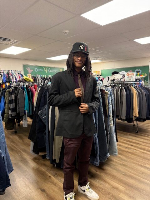 hornet hope center student trying on clothing