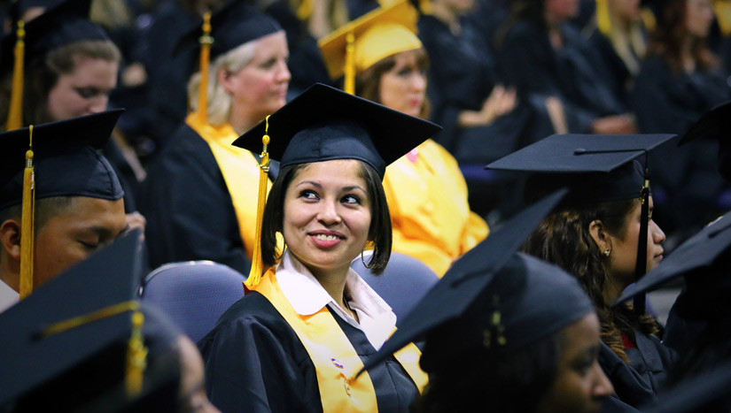 people-student-computer-|2014-Female-Graduate |2014 Graduate smiling at commencement