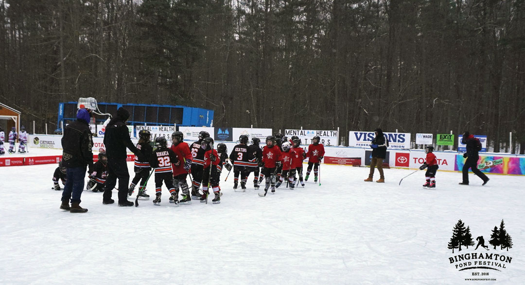 Children playing on the ice rinks at Binghamton Pond Festival.