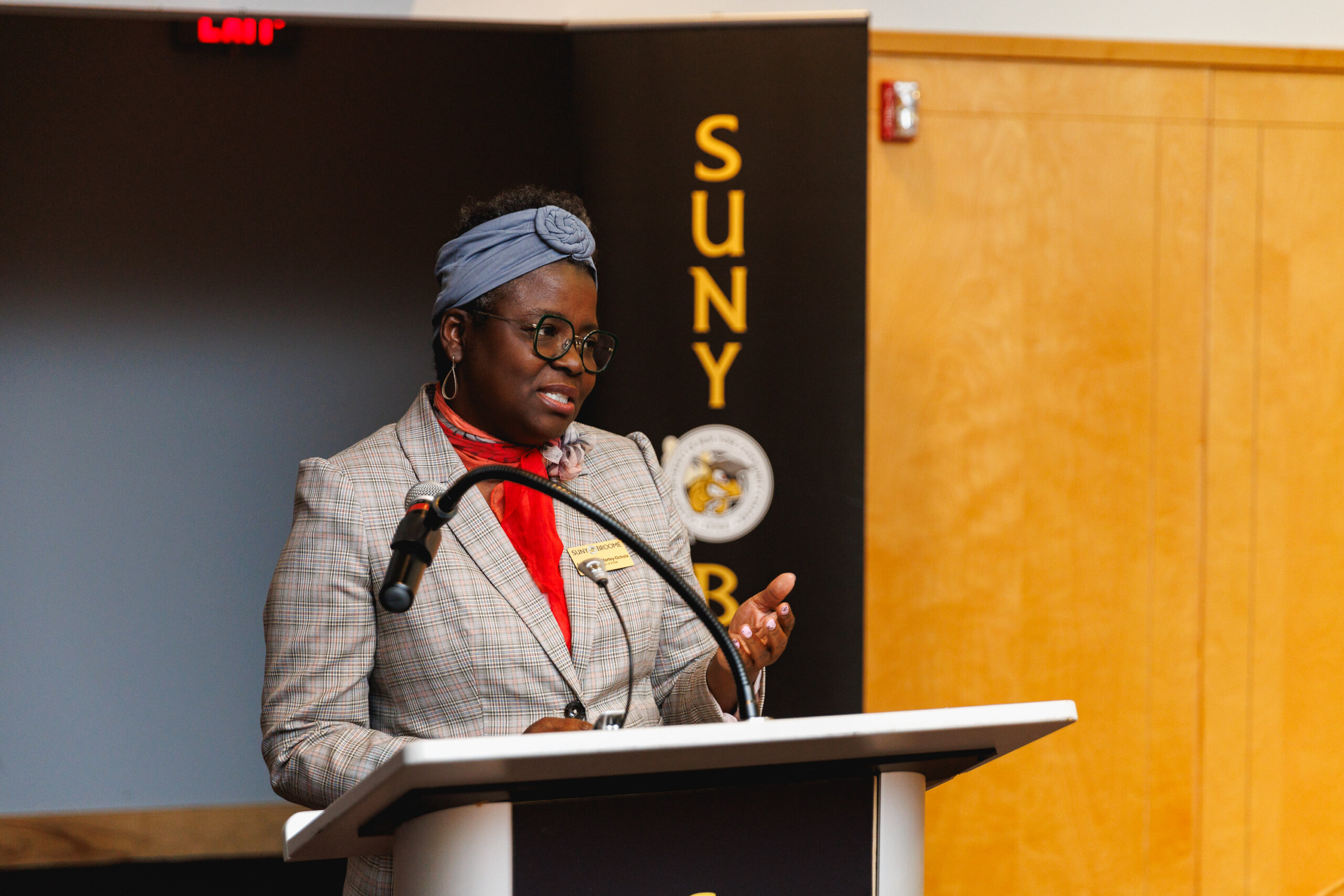 Interim Dean of STEM Dr. Christine Martey-Ochola speaks to the room of medal recipients and their family and friends