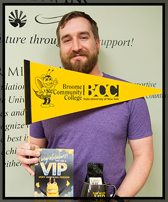Nick Wagner smiles as he holds his VIP gifts