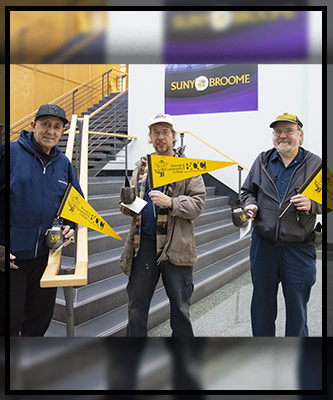 Three of the custodial services, grounds-keeping and maintenance team