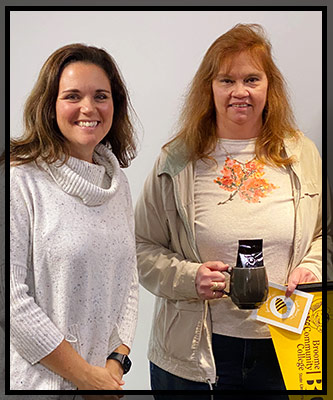 Sandi poses with Lisa as she receives her VIP items