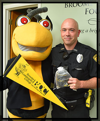 Justin hugs Stinger and holds his gift.