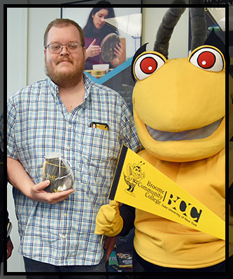 Steve holds his gift.
