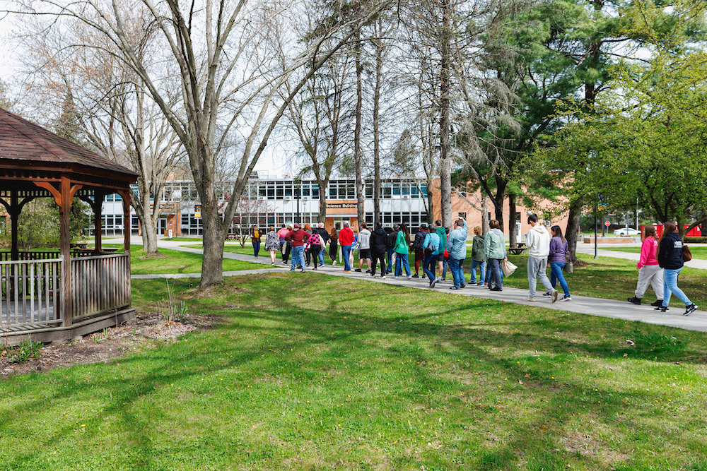 students on campus taking tour
