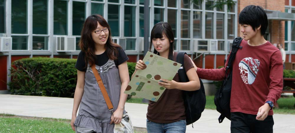 Students walking down sidewalk
