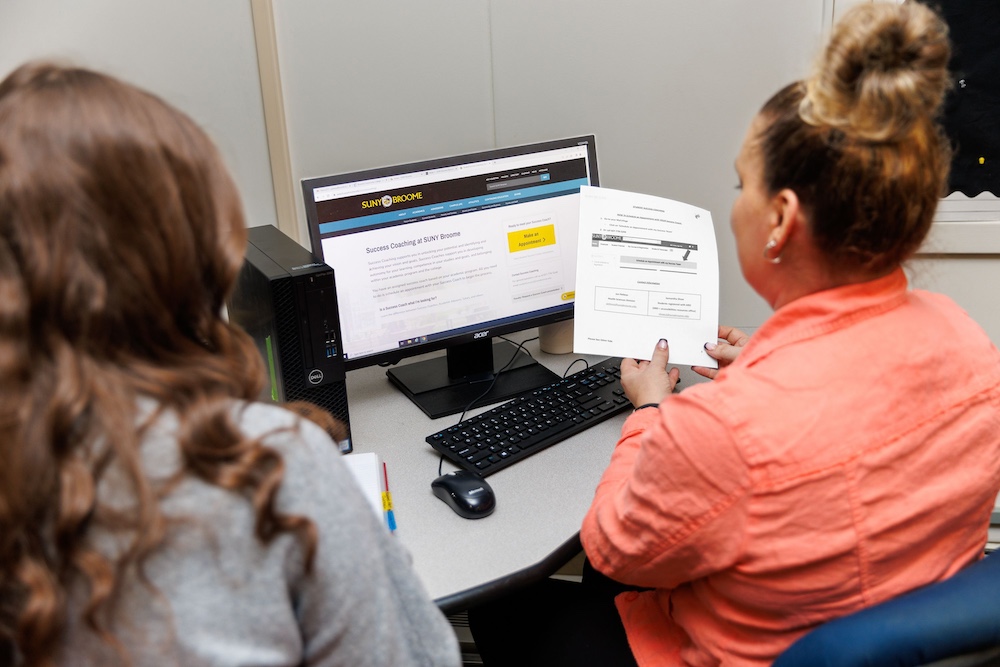 success coach success coach working in office with student