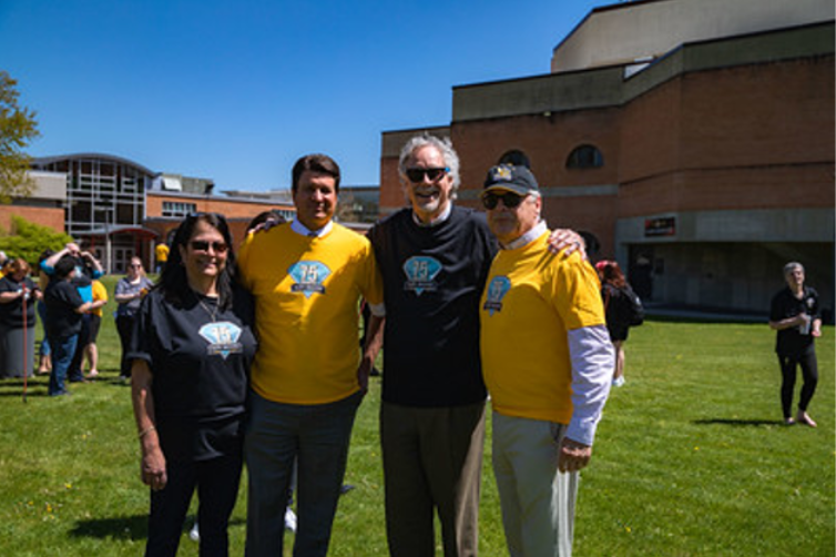 Campus leaders, including Dr. Drumm, smiling for the camera