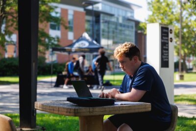 student working on computer on suny broome campus